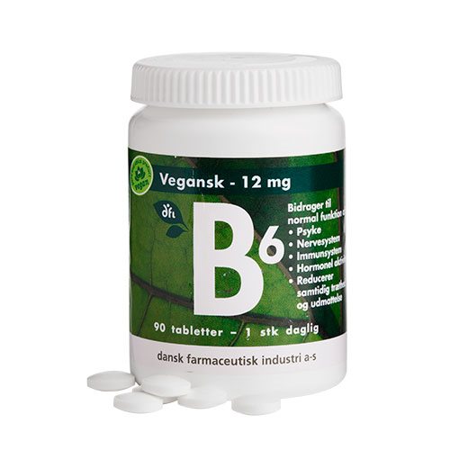 Weiße Dose mit veganem B6 12 mg Nahrungsergänzungsmittel, grünes Etikett, 90 Tabletten und einzelne Tabletten davor